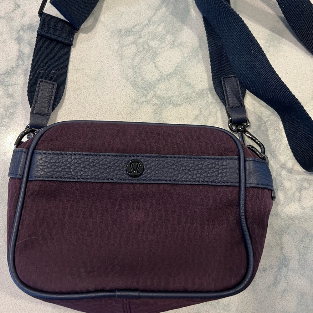 Lululemon crossbody/ Fannie pack type of strap and bag. deep burgundy and black